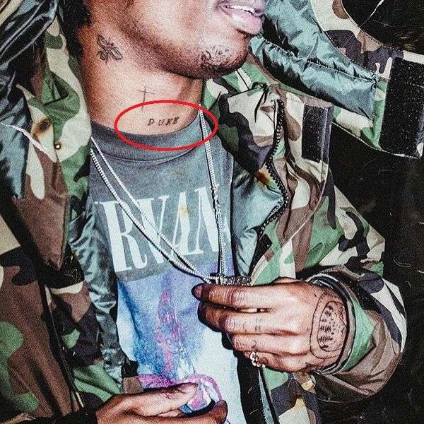 “PUKE” on his Neck Travis Scott Tattoo 